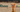 A dog on a field, Gutsy logo and Winner logo.