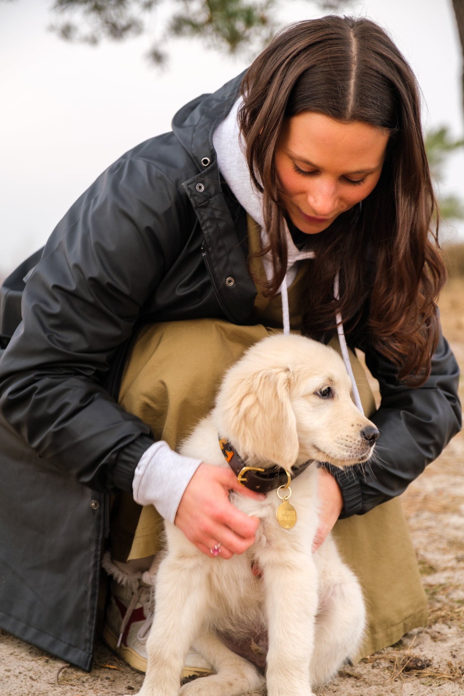 photo of a woman holding her puppy